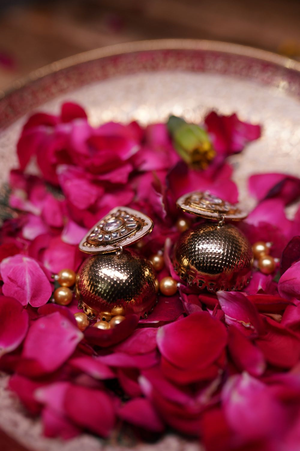 Antique gold temple jhumka with textured detailing