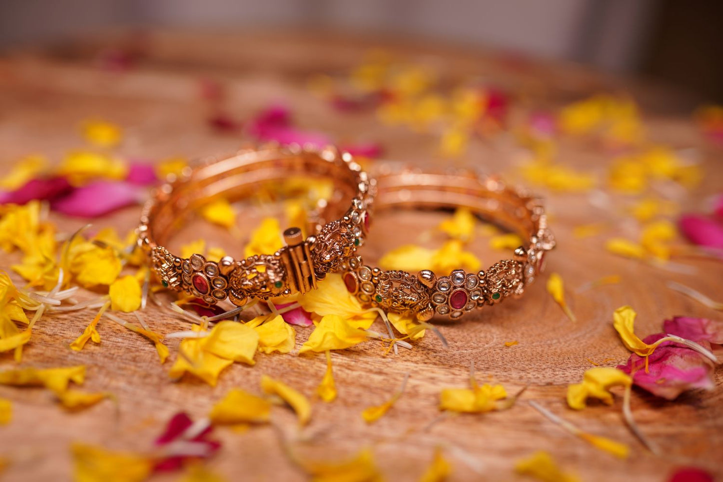 Antique gold kada bangles with multicolor gemstone detailing