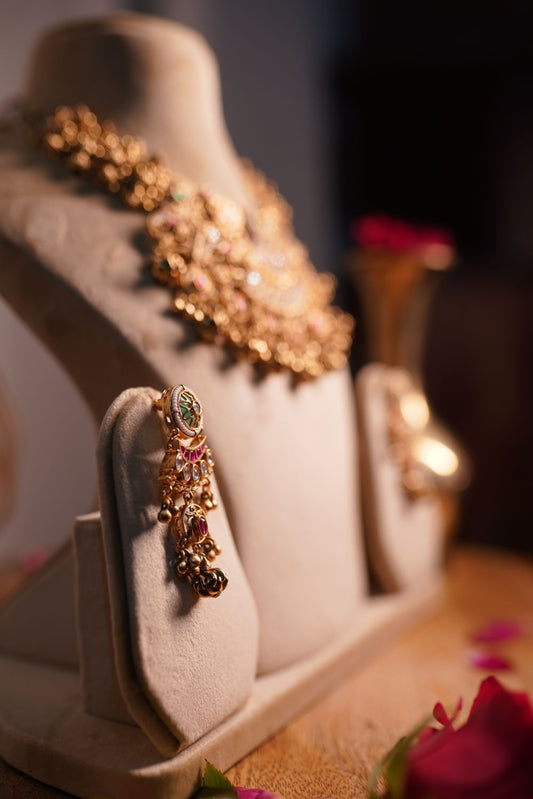 Antique gold temple choker with ruby and emerald stones