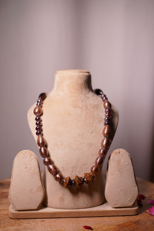 Bronze beaded mala with decorative centerpiece