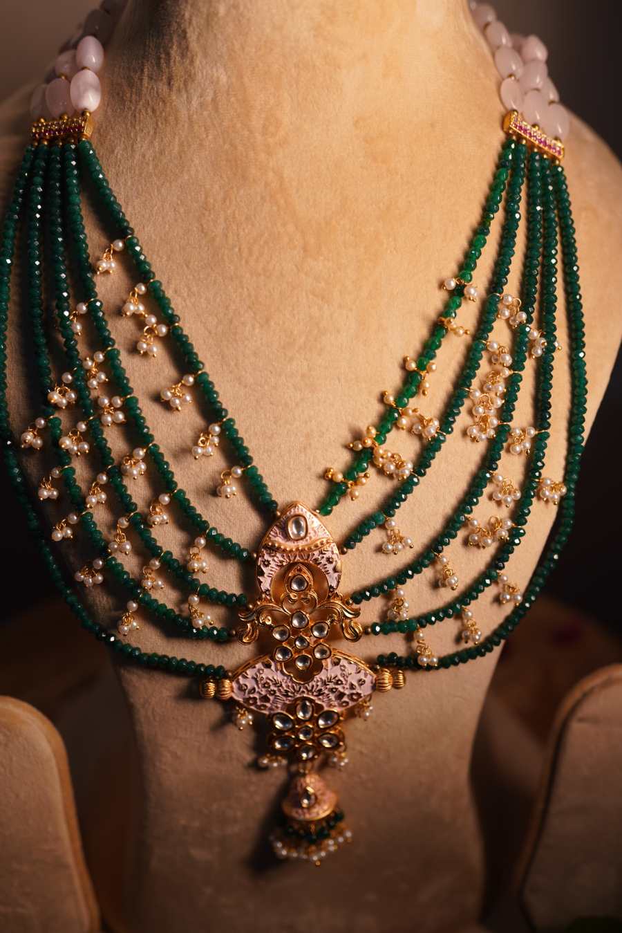 Emerald green beads with antique gold temple pendant