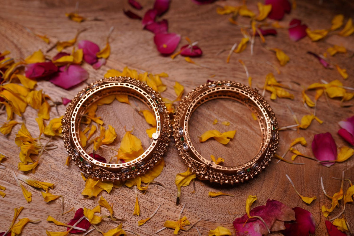 Golden filigree bangles with handcrafted detailing