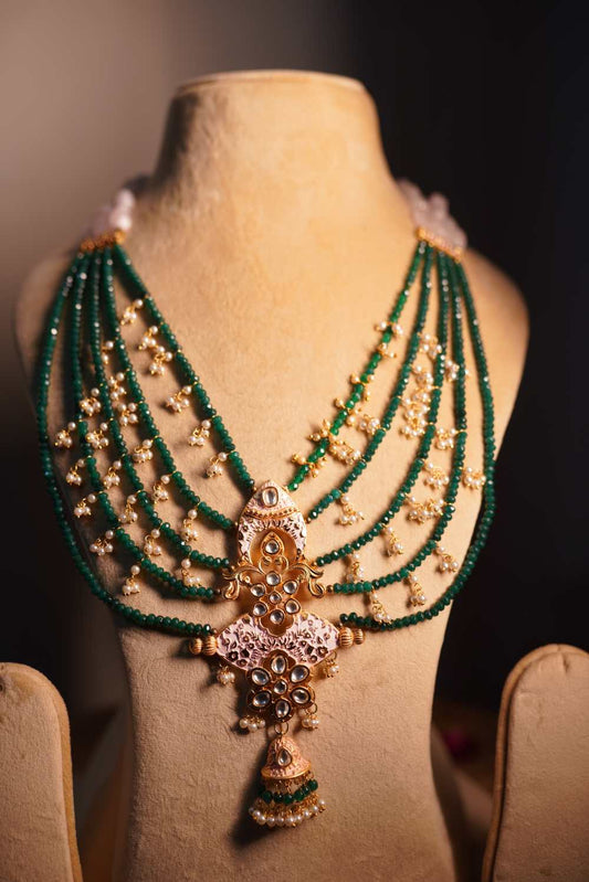 Grand emerald green beaded mala with antique gold temple pendant