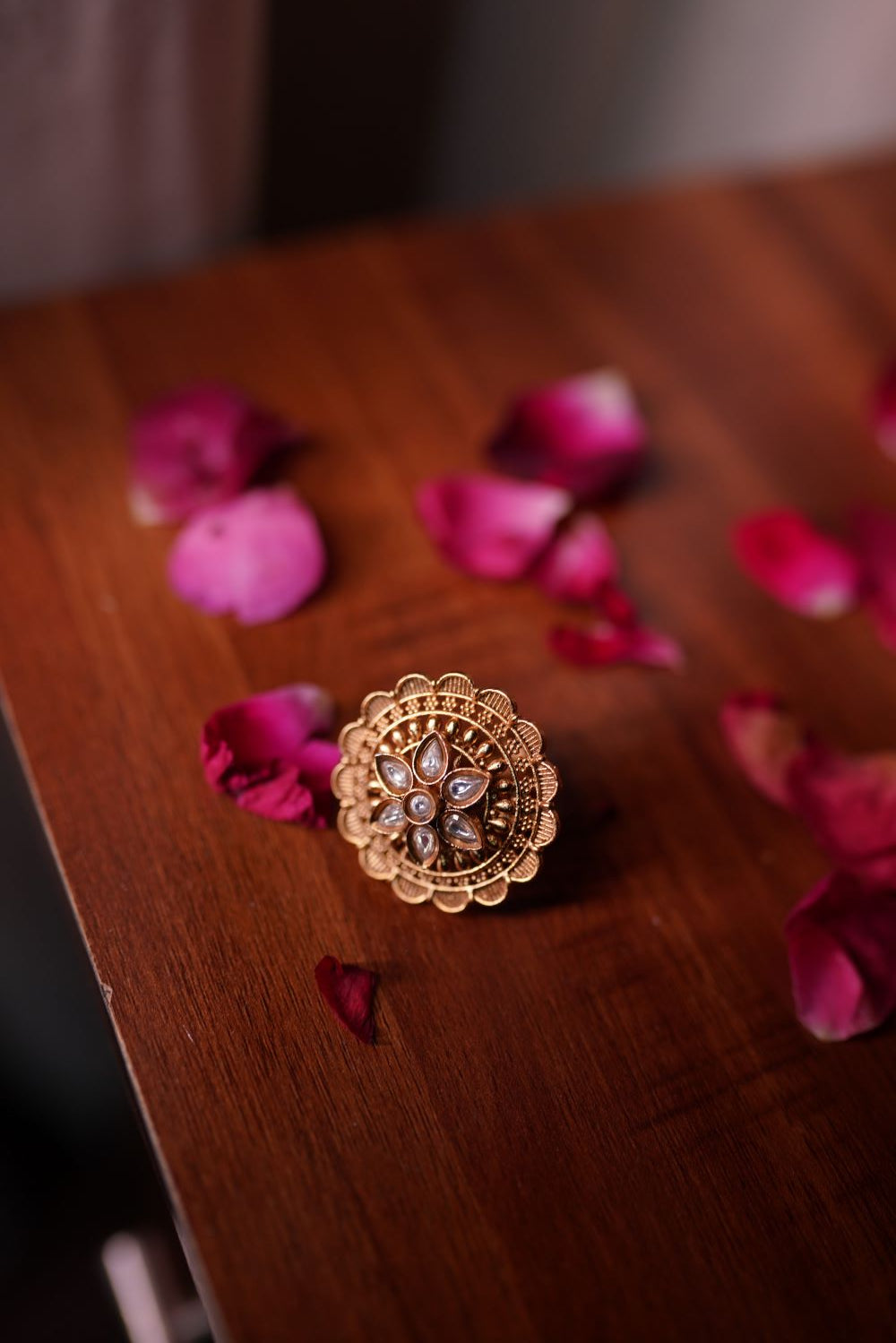 Handcrafted traditional gold-toned ring with floral design