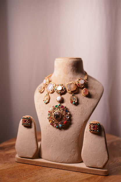 Detailed view of handcrafted Navratan gemstones and intricate meenakari work on the Fashiyano cascade bridal necklace.