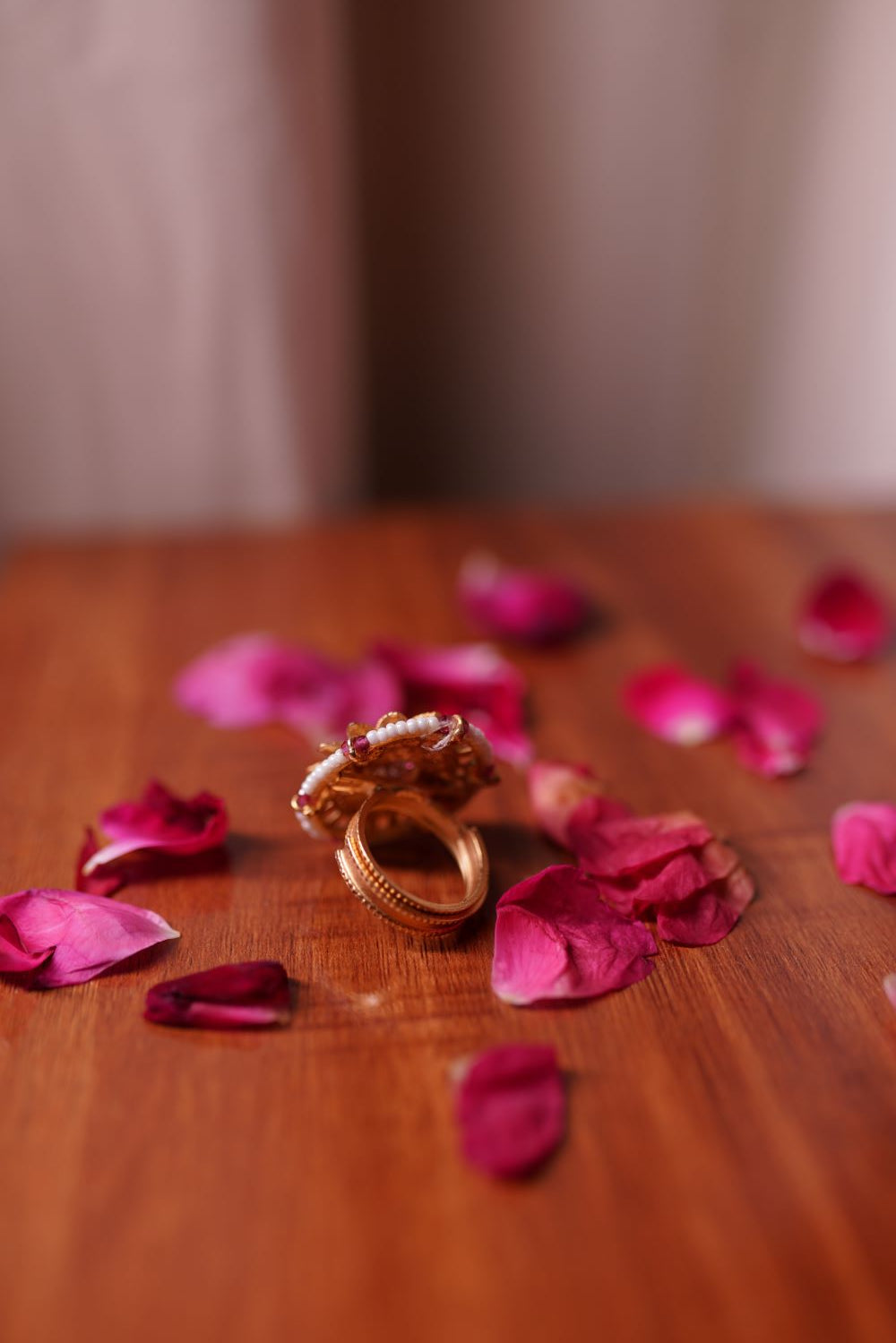Traditional floral Kundan ring with stone accents