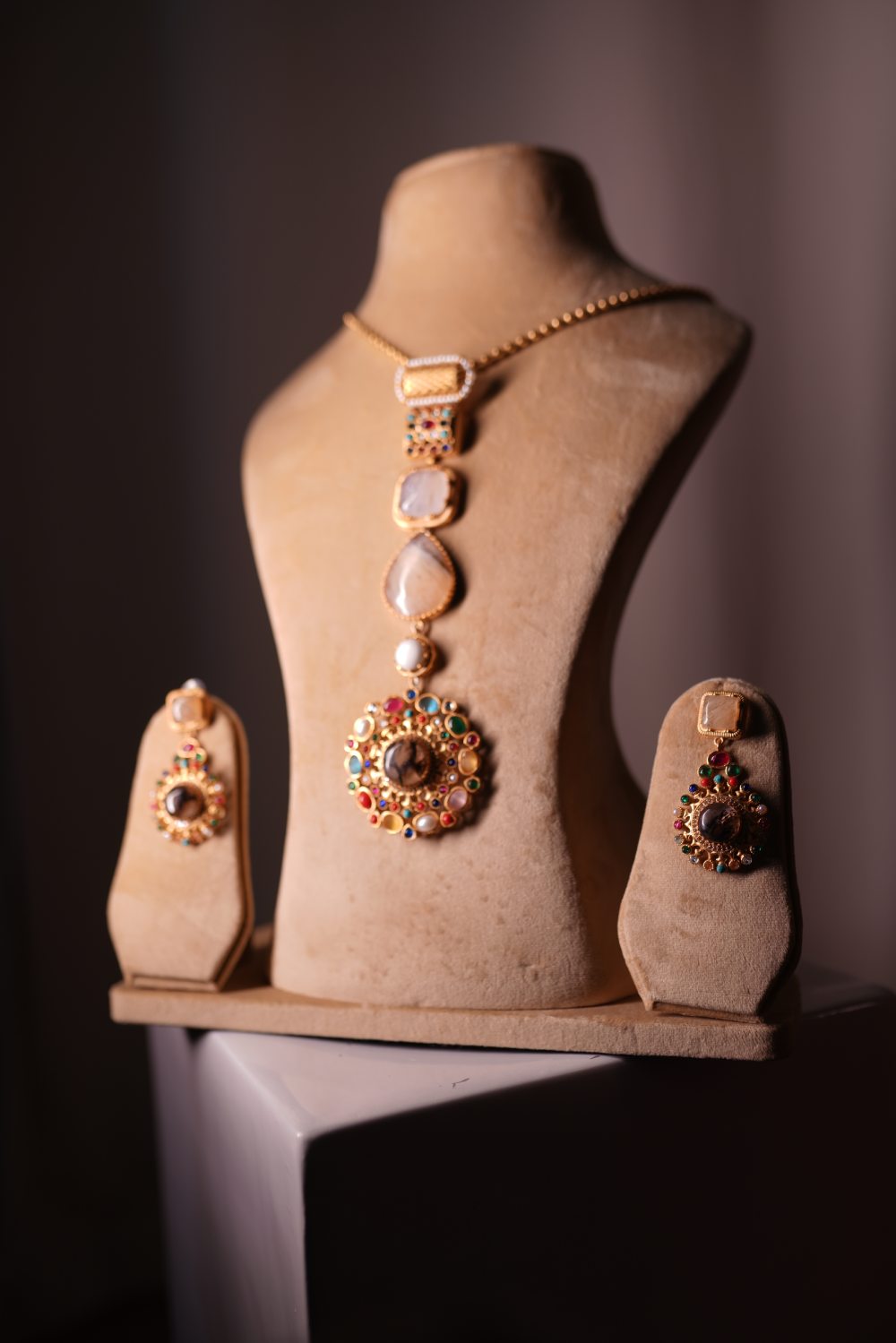 Woman wearing antique gold vertical cascade bridal necklace