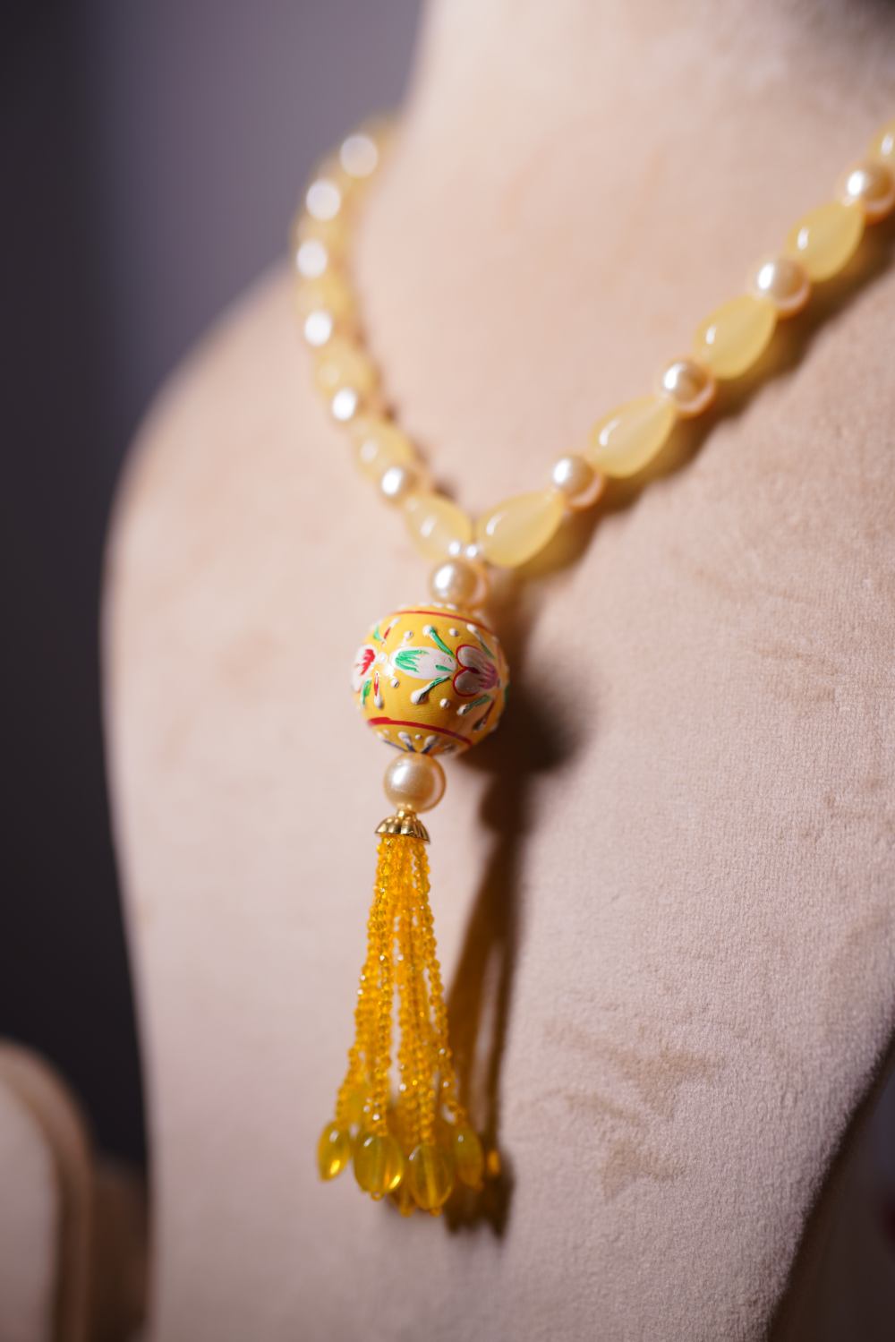 Yellow jade beads with detailed meenakari pendant